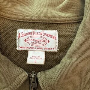 Filson 1/4 zip in front.  Worn once bought in NE Filson shop.